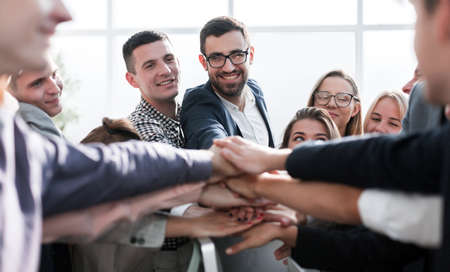close up. group of young business people putting their palms togetherの写真素材