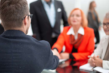 Businesspeople discussing together in conference room