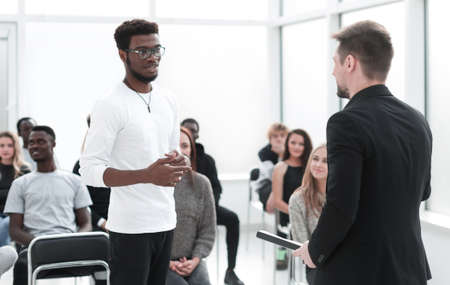 speaker discussing something with a young listener