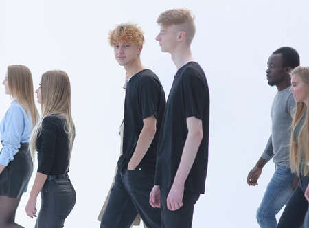 casual young people passing by each other