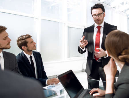 businessman holds a briefing with the business team