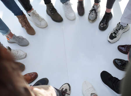 cropped image a group of diverse people standing in a circleの写真素材