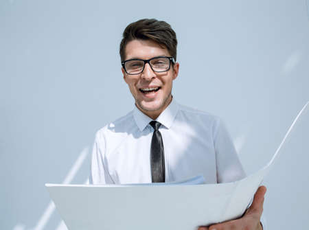 close up.happy businessman looking at business document