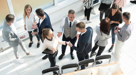 top view. a group of employees discussing work issues