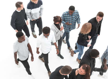 group of diverse young people pointing somewhere up