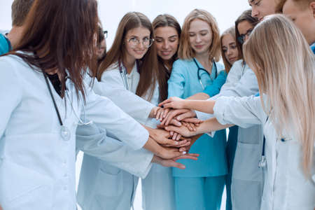 top view. a group of smiling doctors pointing at you.の写真素材