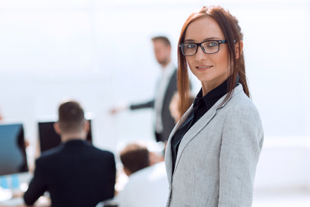 Executive young business woman on office backgroundの写真素材