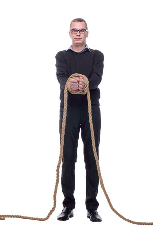 Businessman with a rope tied his handsの写真素材