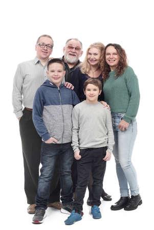 in full growth. happy family standing together.の写真素材