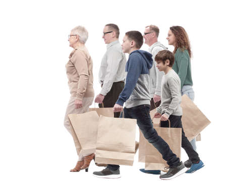 in full growth. family with shopping bags .の写真素材