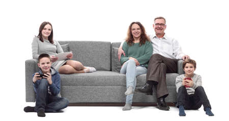 happy family sitting on a large comfortable sofa.