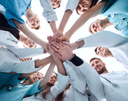 bottom view. a group of medical colleagues putting their hands together.の写真素材