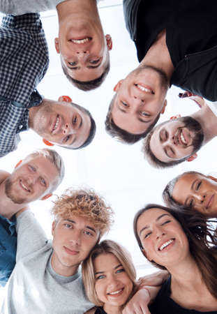 bottom view. group of diverse young people standing in a circle.の写真素材