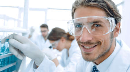 close-up of a happy male scientist wearing safety glassesの写真素材