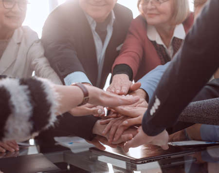 Group of business people joining hand together for making a dealの写真素材