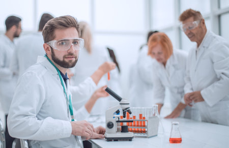 close up. young scientist sitting at a table in the laboratory.の写真素材