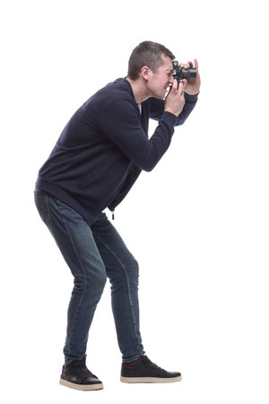 young man with a camera. isolated on a whiteの写真素材