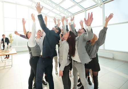 happy young business team celebrating in a new office.の写真素材