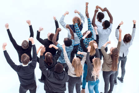 group of diverse young people pointing somewhere up