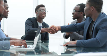 happy business people shaking hands at office meetingの写真素材