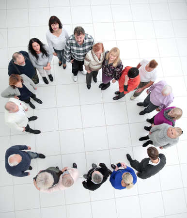 group of casual senior people standing in a circle .の写真素材