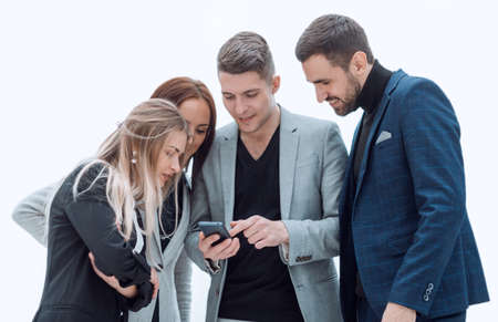 group of smiling employees watching videos on smartphone.