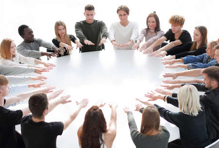 group of young people performing an exercise in a teambuilding class.の写真素材
