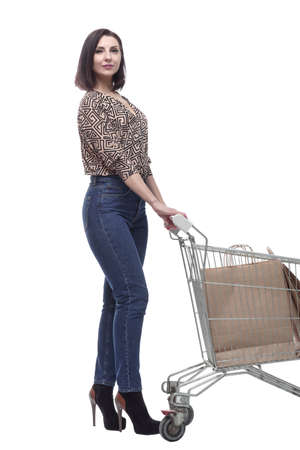 in full growth. an attractive young woman with a shopping cart.の写真素材