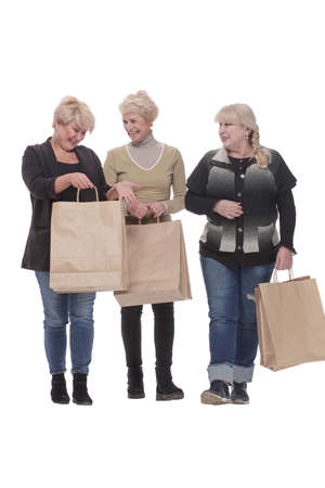 in full growth. three happy women with shopping bags.の写真素材