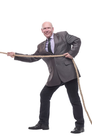 business man pulls a rope. isolated on a white