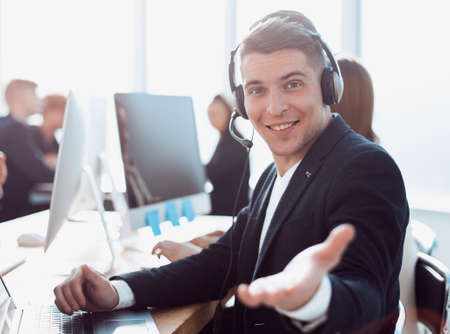 call center operator holding out his hand for a handshake.