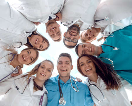 bottom view. diverse medical professionals standing in a circle.の写真素材
