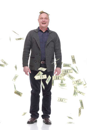 happy casual man with dollar bills .isolated on a white background.の写真素材
