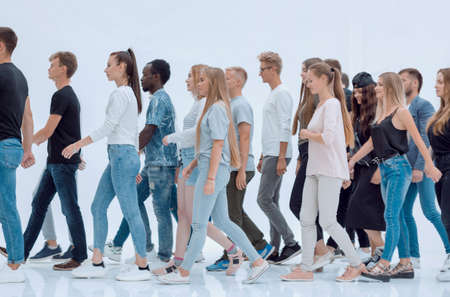 group of young people striding towards their goal.の写真素材