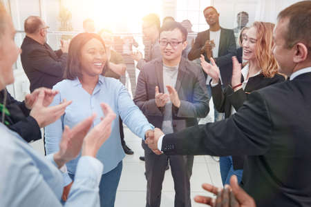 Businesswoman shaking hand to partner in the meeting