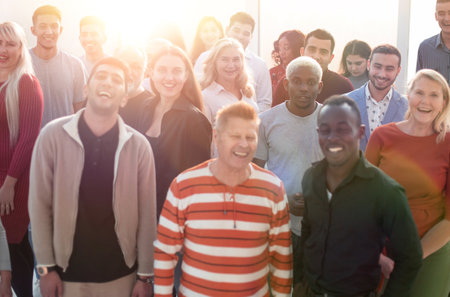 Happy confident business team stands in office