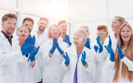 large group of medical researchers applauding together.の写真素材