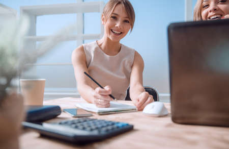 young business woman sitting at office Deskの写真素材