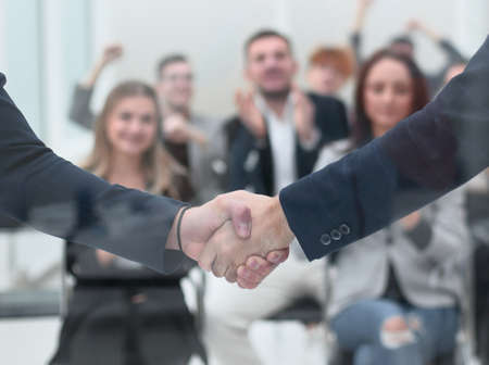 handshake of business people in the conference room.