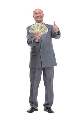 Smiling senior gentleman holding money, isolated on white backgroundの写真素材