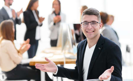 happy businessman sitting near his office Desk.
