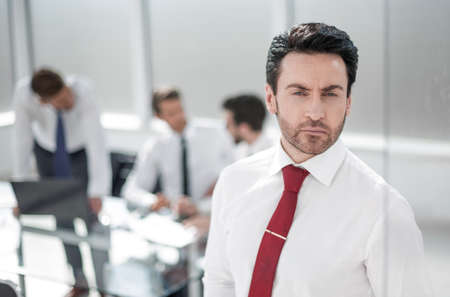 close up.serious businessman standing in the office.の写真素材