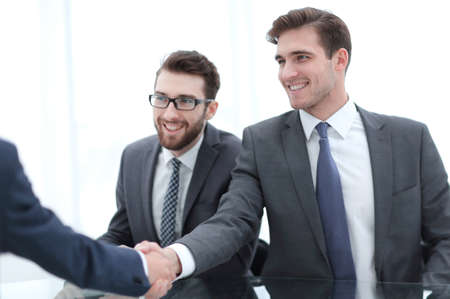 close up.businessman welcomes new business partnerの写真素材