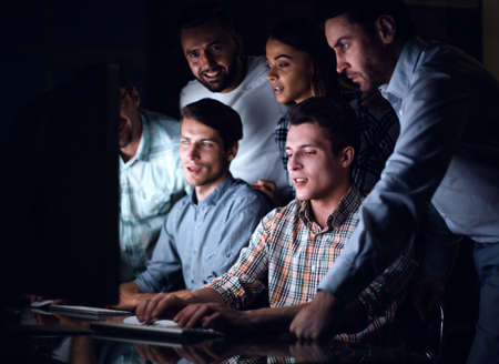 business team looks closely at the computer monitorの写真素材
