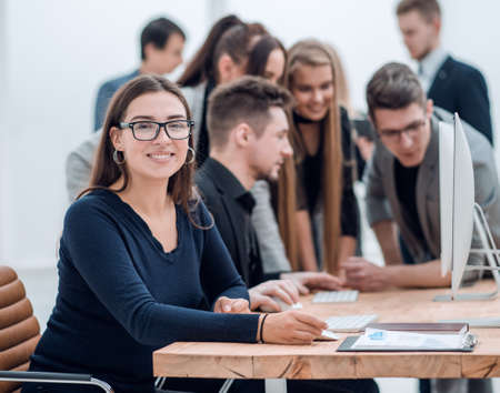young business woman sitting at a Deskの写真素材