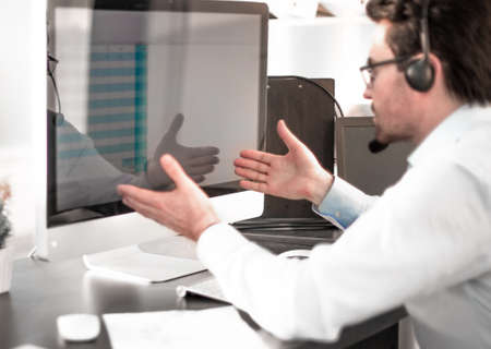 close up.businessman looking at the monitor of a modern computer