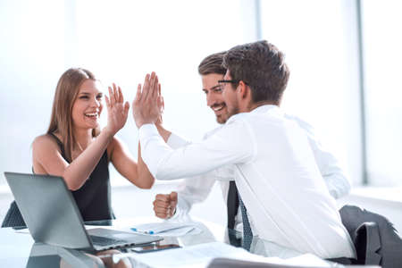 close up. happy employees showing their success