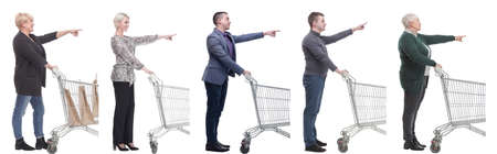 a group of people with a shopping cart point their fingers in front of themの写真素材