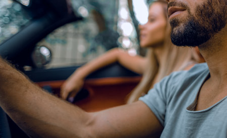 close up.a handsome man driving a luxury car