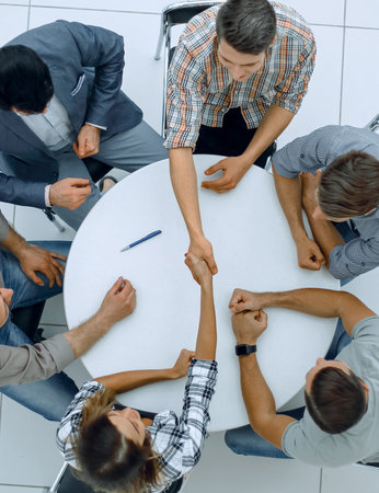 top view.creative business group sitting at the round tableの写真素材